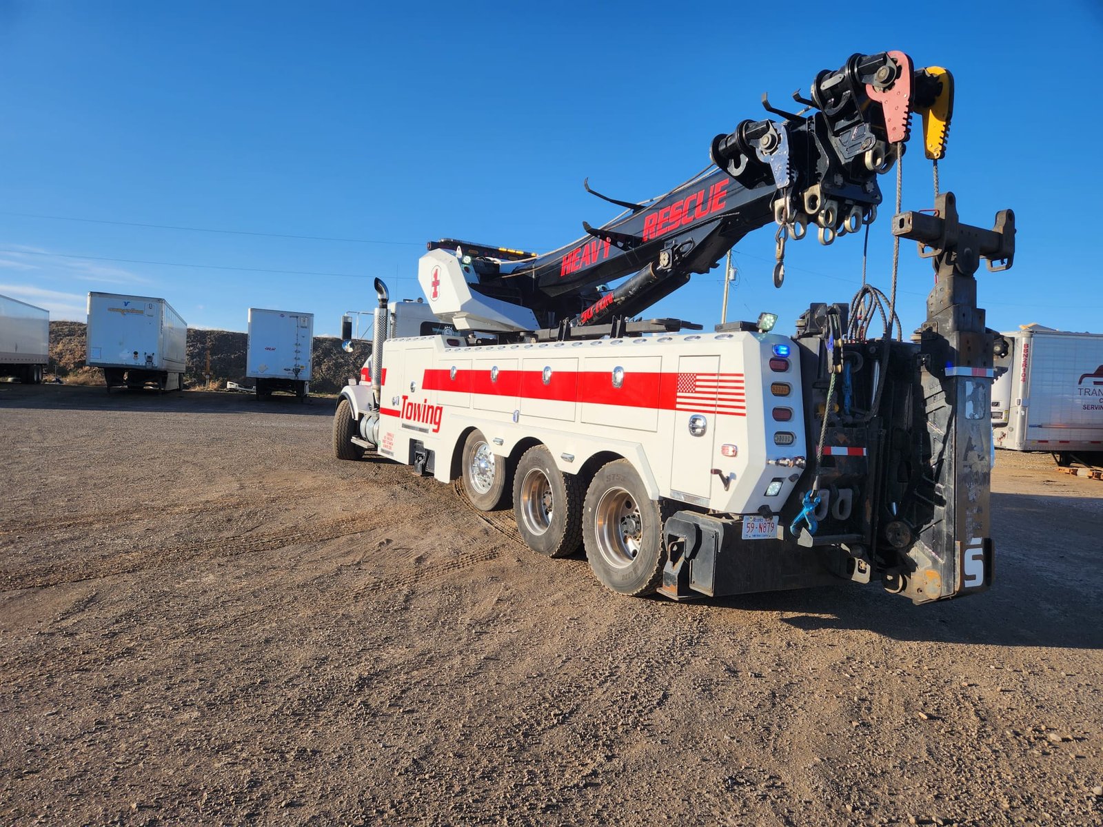 Flatbed tow truck providing emergency towing in Calgary