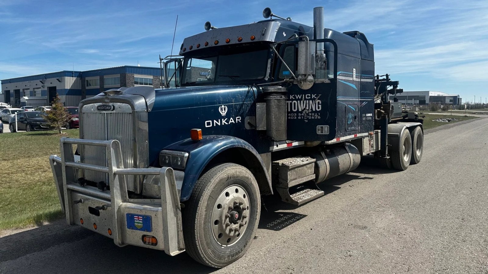 Tow truck providing emergency towing service in Calgary